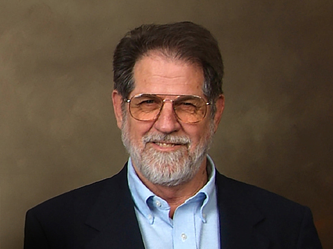 Portrait of W.A. "Bud" Lawrence in a blue blazer, light blue button-down shirt.